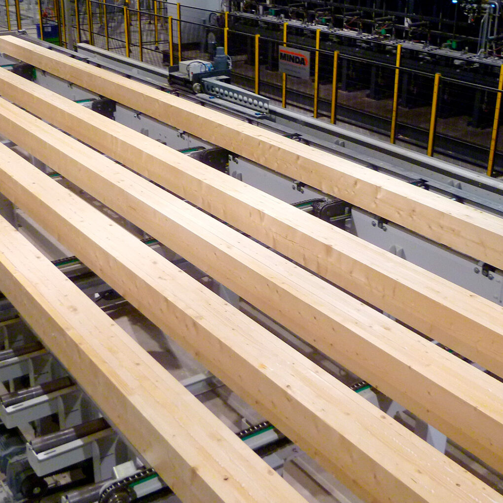 Kuusamo Log Houses’ laminated log blanks on the sawmill production line.