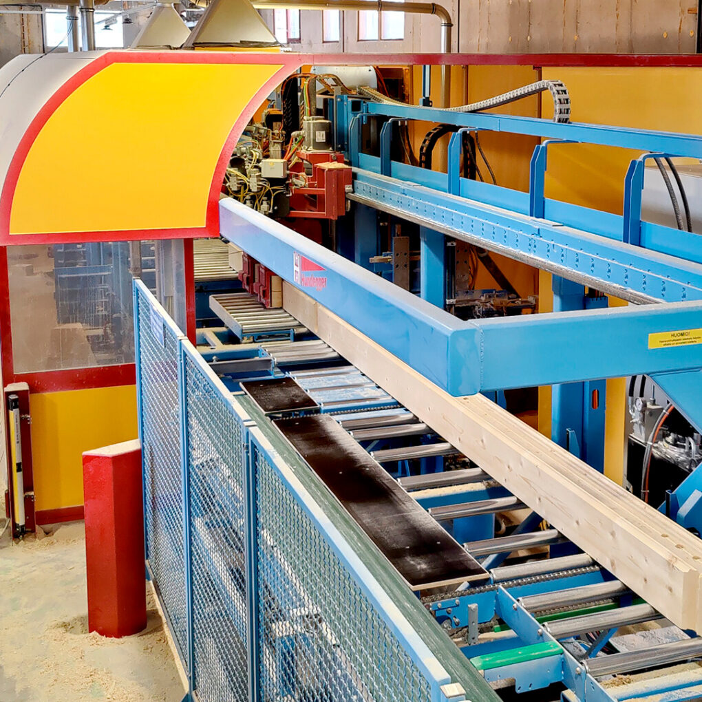 At the Kuusamo Log Houses factory, laminated logs on the production line.