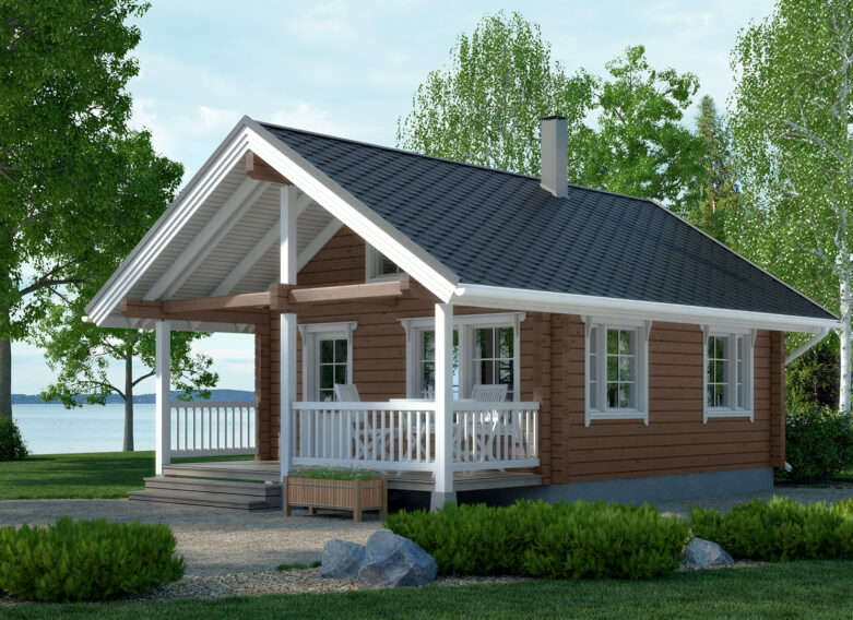 A traditional log cabin with a gabled roof. There is a small terrace area by the entrance to the cabin.