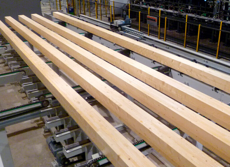 Laminated log blanks before being planed to shape on the Pölkky production line.