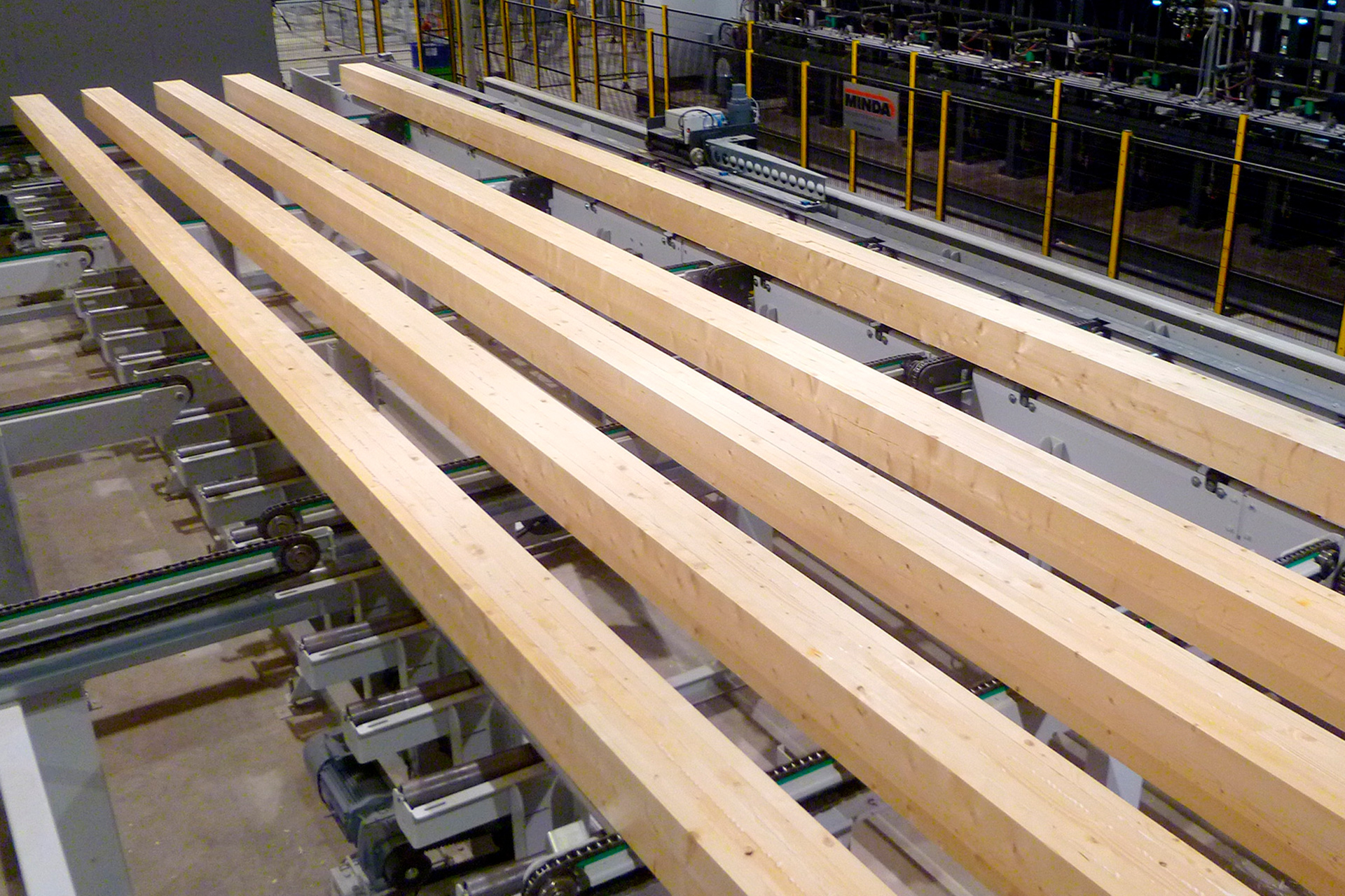 Laminated log blanks before being planed to shape on the Pölkky production line.