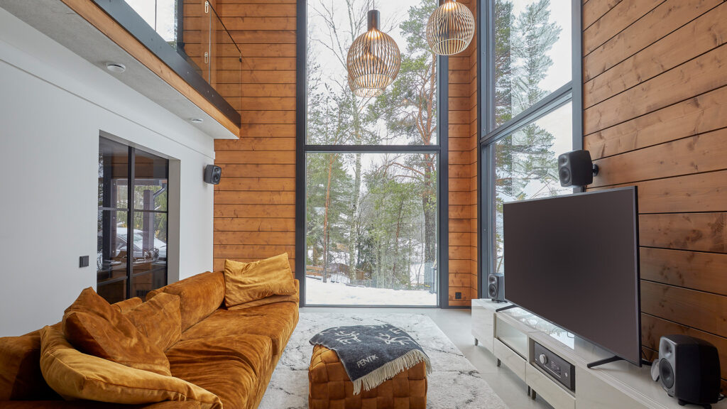 The highlight of the living room is the double-height windows on either side of the corner.