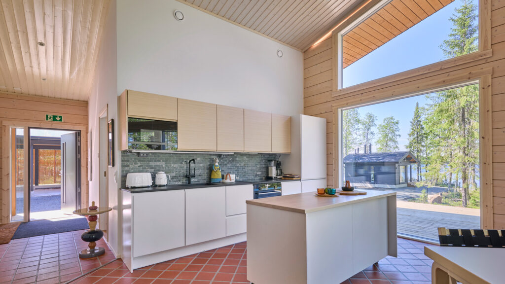 The kitchen, with fitted units in wood and white.